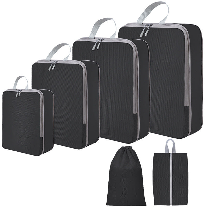 Zwarte PAKHELDER reisorganizer set voor kleding en reisbenodigdheden in een koffer