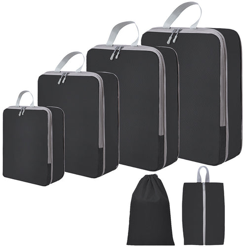 Zwarte PAKHELDER reisorganizer set voor kleding en reisbenodigdheden in een koffer