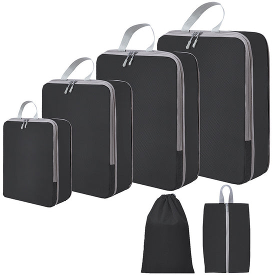 Zwarte PAKHELDER reisorganizer set voor kleding en reisbenodigdheden in een koffer