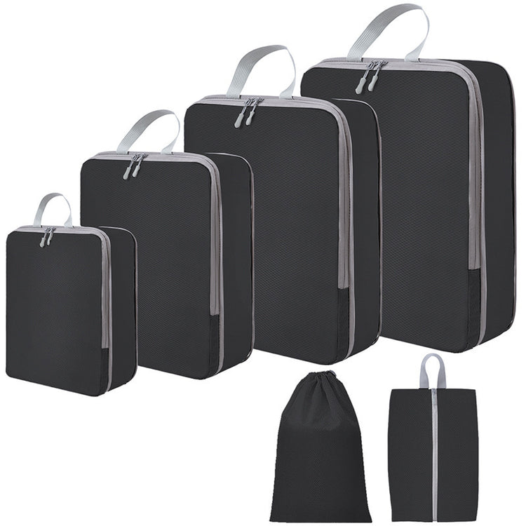 Zwarte PAKHELDER reisorganizer set voor kleding en reisbenodigdheden in een koffer